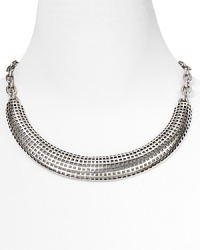 Make edgy your signature with Giles & Brother's perforated silver collar. Worn with a crew neck or strapless dress, this clavicle-grazing accessory adds a cool hit of shine.