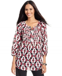 Style&co.'s latest petite blouse looks stylish with a tribal-inspired print and pretty details, like a pleated front placket and shirttail hem.