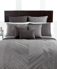 A central zigzag motif of silvery pleats collect down the center of this Pieced Pintuck European sham, offering versatile texture that redirects light in waves. Coordinate this sophisticated design with Pieced Pintuck gray accents to vivify the look of your bedroom. (Clearance)