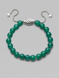 Rich green onyx is fastened by an adjustable clasp of sterling silver.Green onyx Sterling silver Bead diameter, about ¾ Imported