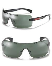 These sporty shades from Prada feature a sleek silhouette and logo detail along arms.