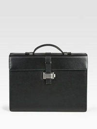 Single-gusset briefcase made of full-grain calfskin leather with a full, jacquard lining, ruthenium-plated metal accents and a unique lock closure.Top handleFlap front latch closureLeather14W x 10¼H x 4DMade in Italy