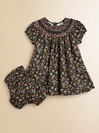 Tailored in airy cotton for a gently flowing silhouette, a darling short-sleeved floral-print dress is beautifully complemented with a smocked neckline and embroidery. Round smocked necklineShort puffed sleevesBack buttonsFull skirtRuffled hemCottonHand washImported Please note: Number of buttons may vary depending on size ordered. 