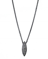 A chic canoe-shaped pendant adds a distinctive design detail to T Tahari's necklace. Accented by glittering black diamond-hued crystals, it's set in hematite tone mixed metal. Approximate length: 18 inches + 3-inch extender. Approximate drop: 1/4 inch.