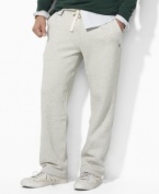 A classic-fitting drawstring pant in soft fleece is designed for casual comfort and style.