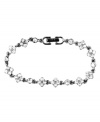 Subtle sparkle. Understated elegance best describes this simple yet stunning bracelet from Givenchy. Enhanced with twinkling crystal accents, it's crafted in hematite tone mixed metal. Approximate length: 7-1/4 inches.