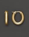 Bold oval hoops, in 18K yellow gold. By Roberto Coin.