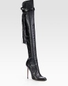 Make an impact with this tall leather boot, amplified by vintage-inflected fringe details and a piercing heel. Self-covered heel, 4 (100mm)Shaft, 24Leg circumference, 14Leather upperPull-on style with leather adjustable strapLeather lining and solePadded insoleMade in Italy