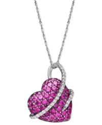 Everyone wants to be in love. Embrace it with this heart-shaped stunner. Crafted in sterling silver, round-cut rubies (2-1/2 ct. t.w.) and swirls of round-cut diamonds (1/5 ct. t.w.) create a magical look. Approximate length: 18 inches. Approximate drop: 3/4 inch.