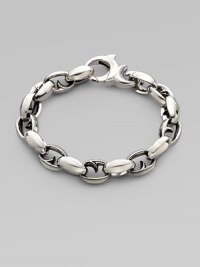 Alternating oval and thorn links in polished sterling silver. About 9½ long Lobster clasp Imported