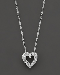 A beautiful diamond heart pendant in 14 Kt. white gold, with rope chain.