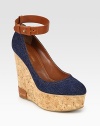 Comfortable cork wedge with a stretch denim upper and an adjustable leather ankle strap. Cork and leather wedge, 5 (125mm)Cork platform, 2 (50mm)Compares to a 3 heel (75mm)Denim and leather upperLeather liningRubber solePadded insoleMade in Spain