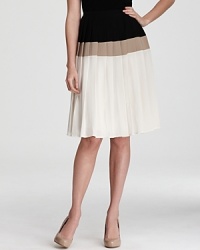 Pairing crisp color blocking with a classic pleated silhouette, this RAOUL skirt infuses your workweek wardrobe with modern femininity.