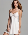 Exude elegance in Elle Macpherson's short flowy chemise with sheer lace panels and trim.