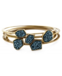 Tough as rocks! This edgy BCBGeneration style combines chunky green drusy shapes on 5 thin bangles, perfect for layering. Set in gold tone mixed metal. Approximate diameter: 2-3/4 inches.