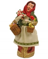 Like a traditional baboushka, this handcrafted figurine from Byers' Choice carries dolls, apples and more gifts for children to cherish. The scarf around her head and intricate detail in her attire evoke the old world.