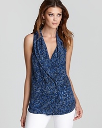 A shawl collar lends polish to this printed Rachel Zoe sleeveless top, perfect now and later under a blazer. The double-breasted silhouette is a true classic and reflects your refined style.