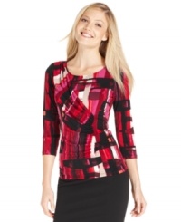 Calvin Klein's printed top features a fitted silhouette and flattering ruching.