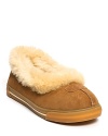 Kick up your feet in these slip-on skimmer slippers with shearling cuff from UGG® Australia.