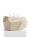 Set the mood in stone. Chiseled and sanded by hand, no two candle holders are exactly alike but each is beautifully crafted in Haitian soapstone. A modern shape and organic feel make it a unique home accent – and a great gift!