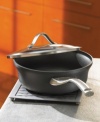 Keep it simple with versatile equipment. This 2.5-quart nonstick shallow saucepan has a capacity indicator line on the rim, making it easy to bring straight from the kitchen to the table. You'll use this handy saucepan regularly. Made of heavy-gauge aluminum, it has an anodized exterior, durable nonstick interior for healthy, low-fat cooking. The ergonomic handle that stays cool during stovetop cooking. The stainless steel band adds style and functionality - there are less crevasses for food to get stuck in. Branded with Calphalon® logo. Lifetime warranty.