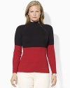 A soft ribbed cotton top is crafted with an angled zipper at the mockneck for sleek, modern style.