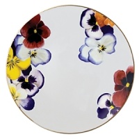 Pensees salad plates by Bernardaud. This lively, luxurious collection is sure to transform your table into a celebration of spring. The floral watercolor pattern features delicate, multicolored pansies that appear to be strewn across the surface of each piece.