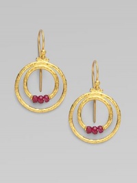 From the Glow Collection. Double hoops of 24K gold with triple ruby accents at the center.Ruby 24K yellow gold Length, about 1 Width, about ½ Ear hooks Imported 