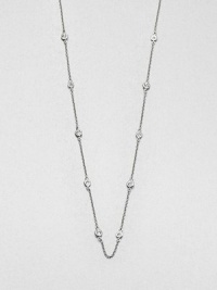 From the Soho Collection. A delicate sterling silver link chain accented with bezel set white sapphire stations. Sterling silverWhite sapphiresLength, about 36Slip on styleImported 