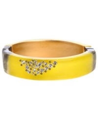 Spice up your style in sweet, candy colors. Kenneth Cole New York's bright yellow resin bangle sparkles with the addition of clustered crystals. Features a hinged clasp set in hematite-plated mixed metal. Approximate diameter: 2-1/2 inches.