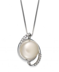 Capture a classic style. This sterling silver necklace suspends a cultured freshwater button pearl (11-12 mm) surrounded by swirls of diamonds for refined elegance. Approximate length: 18 inches. Approximate drop length: 3/4 inch. Approximate drop width: 1/2 inch.