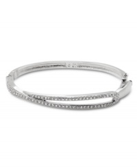 Demure enough for daytime yet equally elegant for evening, Swarovski's Hermine Bangle is a perfectly practical and versatile style. Crafted in silver tone mixed metal, it's adorned with glittering pavé crystals. Approximate length: 7-1/4 inches.