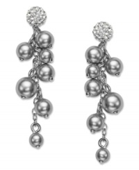 A modern interpretation of a timeless classic. Shining in silver tones, Swarovski's sophisticated pair of rhodium-plated mixed metal pierced earrings enhances any outfit, by day or night. A majestic accumulation of grey crystal pearls dangle from each sparkling stud in clear crystal Pointiage®. Approximate drop: 1-5/8 inches.