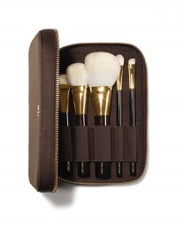 The Tom Ford Brush Set brings ease and luxury to applying your makeup. 5 brushes are meticulously crafted from the finest fibers to perform expertly with Tom Ford color cosmetics. The mahogany-brown, soft-sided portfolio, finished with Tom Ford's signature goldtone zipper, holds the TOM FORD Shade And Illuminate Brush, Bronzer Brush, Cheek Brush, Eye Shadow Contour Brush and Eye Shadow Brush. 