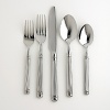 This set includes four each of: dinner fork, dinner spoon, salad fork, teaspoon and dinner knife.