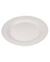 Evoking the natural exuberance of thrown pottery, the Mikasa Swirl dinner plates bring unfussy elegance to your table in classic stoneware.  Dinner plate shown front.