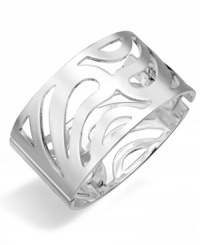 Decidedly decorative. An elaborate openwork design sets apart this striking bangle bracelet from Style&co. Crafted in silver tone mixed metal, it includes a hinge closure. Approximate diameter: 2-3/4 inches x 2-5/16 inches.