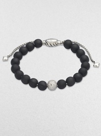 Rich black onyx, accented by a brilliant pavé diamond ball, is fastened by an adjustable clasp of textured sterling silver.Diamonds, 0.87 tcw Black onyx Sterling silver Bead diameter, about ¾ Imported