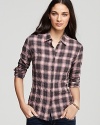 Master the art of tomboy chic in this classic plaid James Perse shirt, inspired by the boys but made just for you.