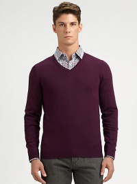 Slim-fitting, extra-fine virgin wool sweater with contrast color detail at inside collar trim.V-neckRibbed knit cuffs and hemWoolDry cleanImported