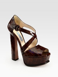 Lustrous Italian leather intersects, forming this sky-high platform silhouette. Self-covered heel, 6 (150mm)Covered platform, 1¾ (45mm)Compares to a 4¼ heel (110mm)Leather upperAdjustable ankle strapLeather lining and solePadded insoleMade in ItalyOUR FIT MODEL RECOMMENDS ordering true size. 