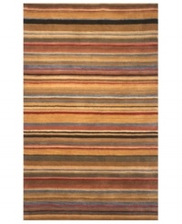 Inspired by the natural landscape, this Petra rug ushers in a new horizon of style to your home. Variegated stripes in camel, sandalwood and earthy tones mix with pops of sky blue for a gorgeously spectral effect. Hand-tufted and hand-finished for a rich, lustrous sheen, this plush wool rug adds a compelling sense of warmth to any room.