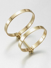 Two bold bangles, joined together, have an industrial screw-in design that enhances their simple drama.BrassDiameter, about 2.75Width, about 1.75Imported