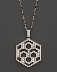 An eye-catching geometric pattern and brilliant diamonds distinguish this sterling silver pendant from India Hicks.