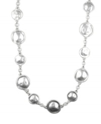 Round up a fabulous, new look in chic circles! Necklace by Jones New York features a circular design and toggle clasp crafted in silver tone mixed metal. Approximate length: 36 inches.