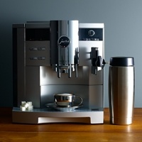 The flagship of the Jura S range of automatic coffee machines, the S9 crafts fine cappuccinos and latte macchiatos with the single press of a button. The insulated 20-oz. stainless steel milk container keeps milk cold for up to 8 hours, and the two separate stainless steel lined ThermoBlock heating systems are always ready for coffee and steam.