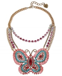 Emerge from your drab cocoon with a little help from Betsey Johnson! This charming frontal necklace features a butterfly pendant with pink, blue and black-colored crystal accents and a pink-colored crystal cup chain. Crafted in antiqued gold tone mixed metal. Approximate length: 16 inches + 3-inch extender. Approximate drop length: 3-3/4 inches. Approximate drop width: 4-1/10 inches.