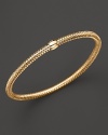 A modern mesh bangle in 18K yellow gold from Roberto Coin.