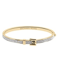 This dainty Michael Kors bracelet is the perfect piece to layer into an armful of bangles. The gold colored band features pave detailing and the center showcases a tiny buckle detail that's the perfect mix of cute and cool.