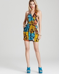 Rendered in rich silk, this Akiko dress boasts a vibrant leaf print for getaway-chic style.